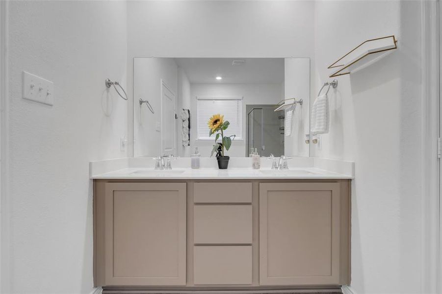 Bathroom featuring vanity and walk in shower