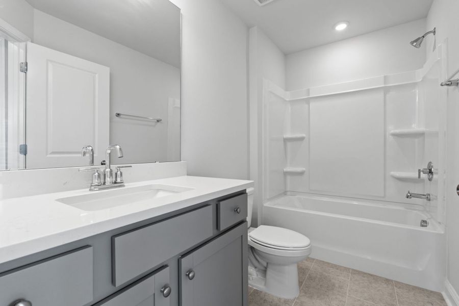 Furnished interior view inside a new home in Lakeside Townes at Riverlights, Wilmington (Image 11).