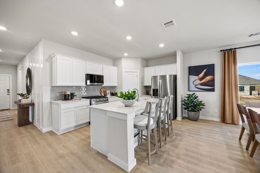 A kitchen with white cabinets. A kitchen with white cabinets.