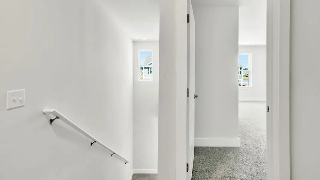 Spacious, unfurnished interior of a new home in The Cove at Indigo Preserve Townhomes, Leland (Image 11).