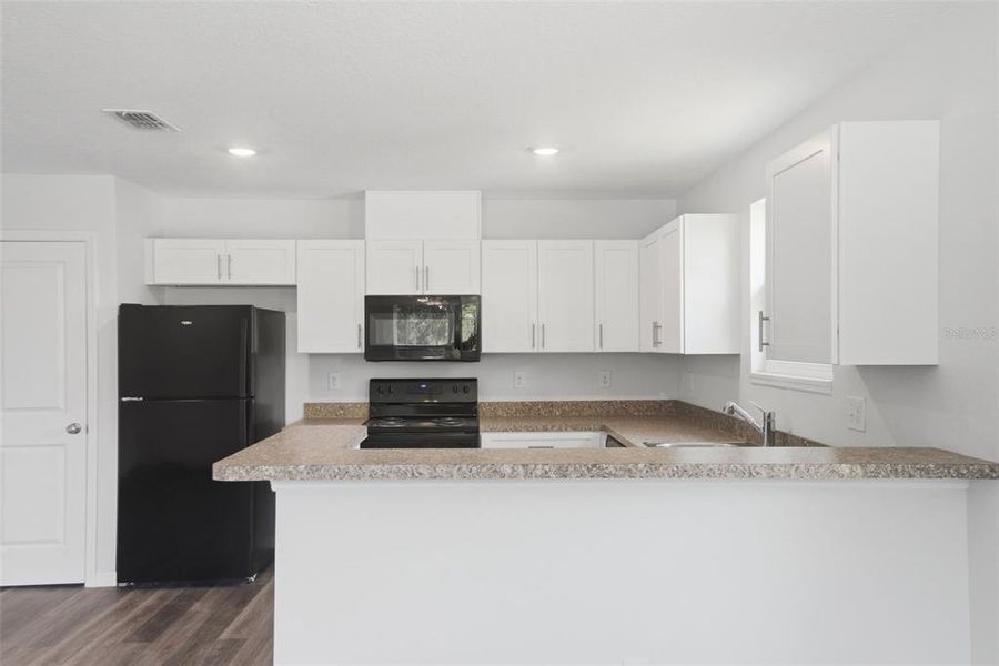 Furnished interior view inside a new home in , Apopka (Image 11).