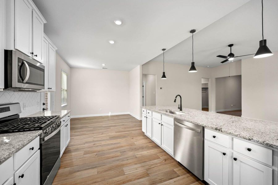 Furnished interior view inside a new home in Sunterra, Katy (Image 7).
