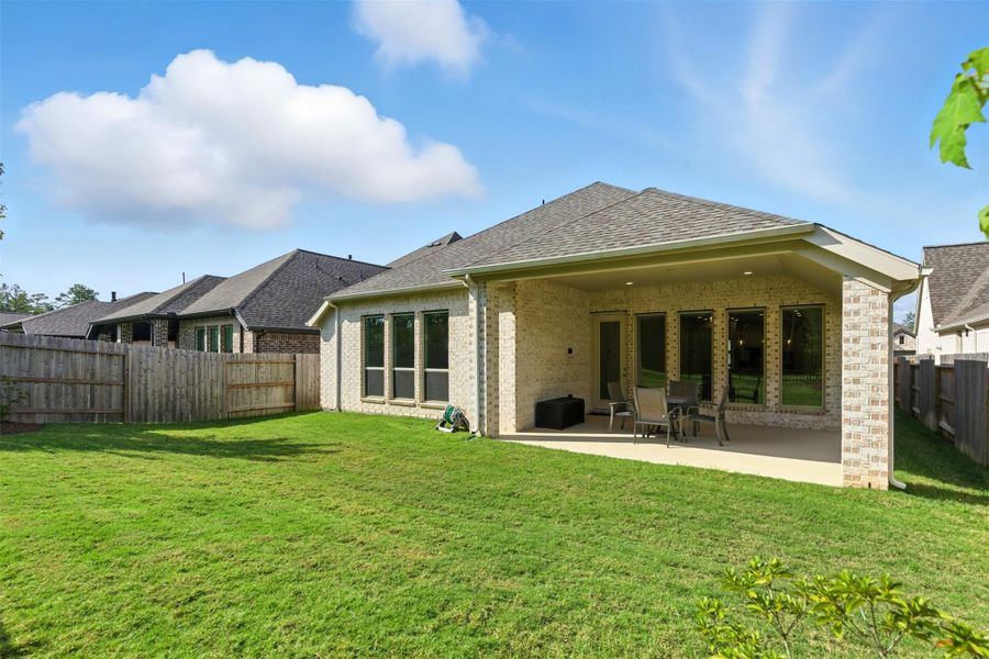 Front exterior of a new home in Artavia 50', Conroe, TX, highlighting curb appeal (Image 2). Front exterior of a new home in Artavia 50', Conroe, TX, highlighting curb appeal (Image 2).