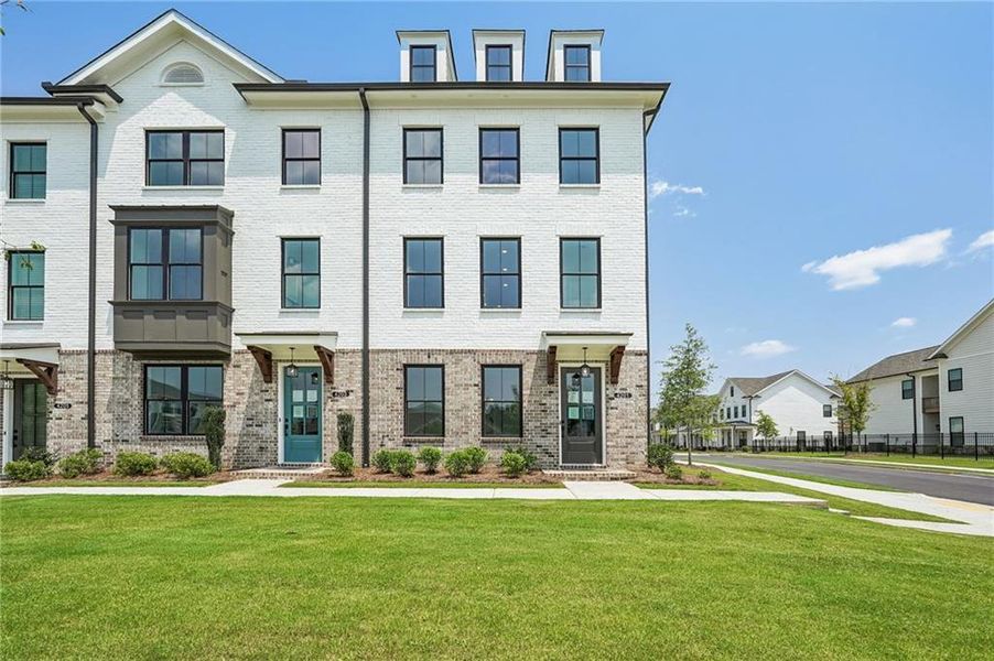 Front exterior of a new home in Millcroft Townhomes, Buford, GA, highlighting curb appeal (Image 33). Front exterior of a new home in Millcroft Townhomes, Buford, GA, highlighting curb appeal (Image 33).