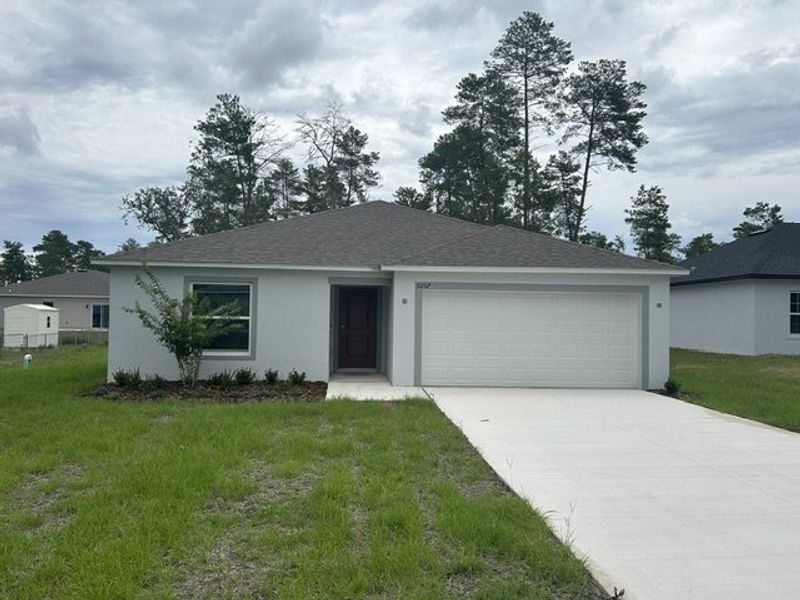 Front exterior of a new home in Marion Oaks, Ocala, FL, highlighting curb appeal (Image 2). Front exterior of a new home in Marion Oaks, Ocala, FL, highlighting curb appeal (Image 2).