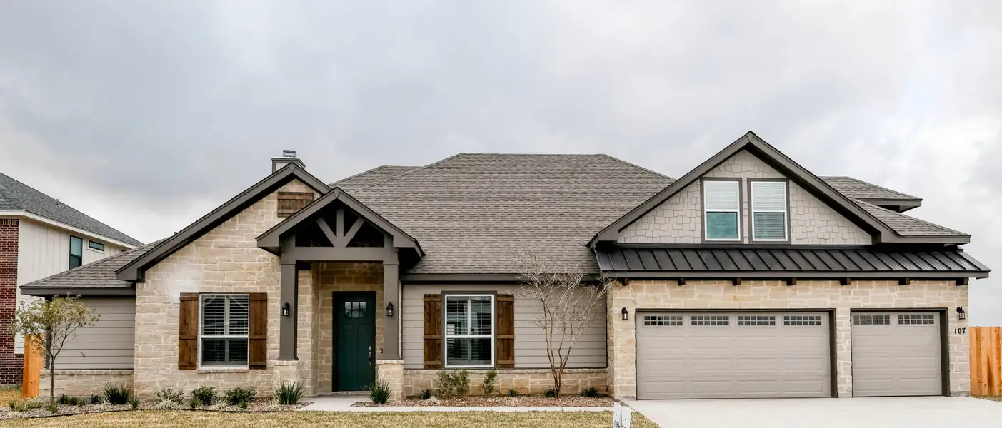 Front exterior of a home in the Escalera Ranch 1833 community, located in Victoria, TX (Image 10).