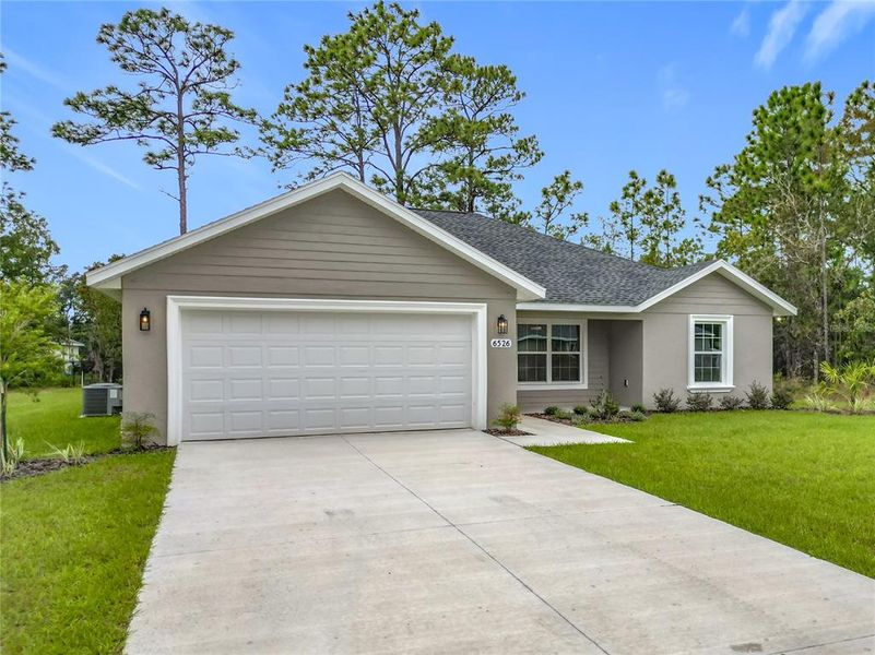 Front exterior of a new home in , Citrus Springs, FL, highlighting curb appeal (Image 26). Front exterior of a new home in , Citrus Springs, FL, highlighting curb appeal (Image 26).