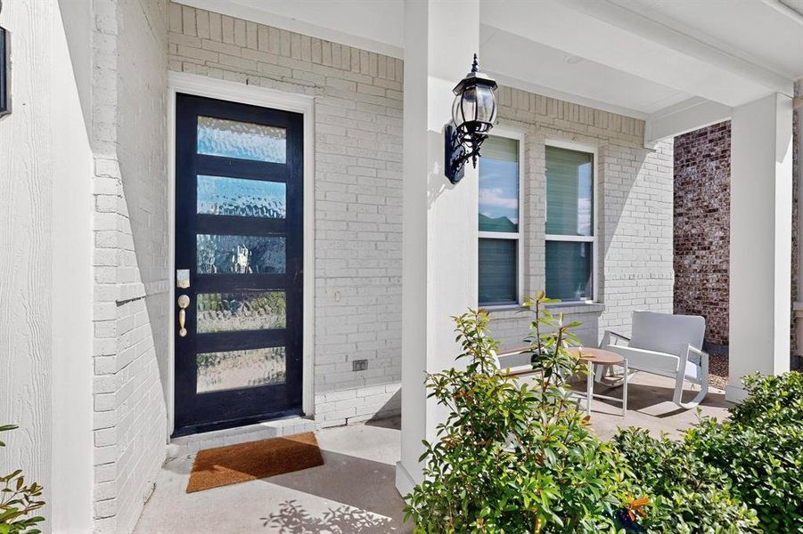 Entrance to property with brick siding and covered porch Entrance to property with brick siding and covered porch