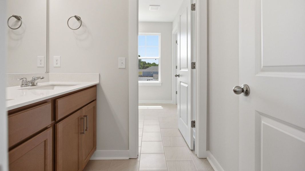 Bathroom with dual vanity and window Bathroom with dual vanity and window