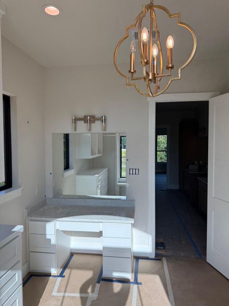 One of the primary closets has a vanity space. One of the primary closets has a vanity space.