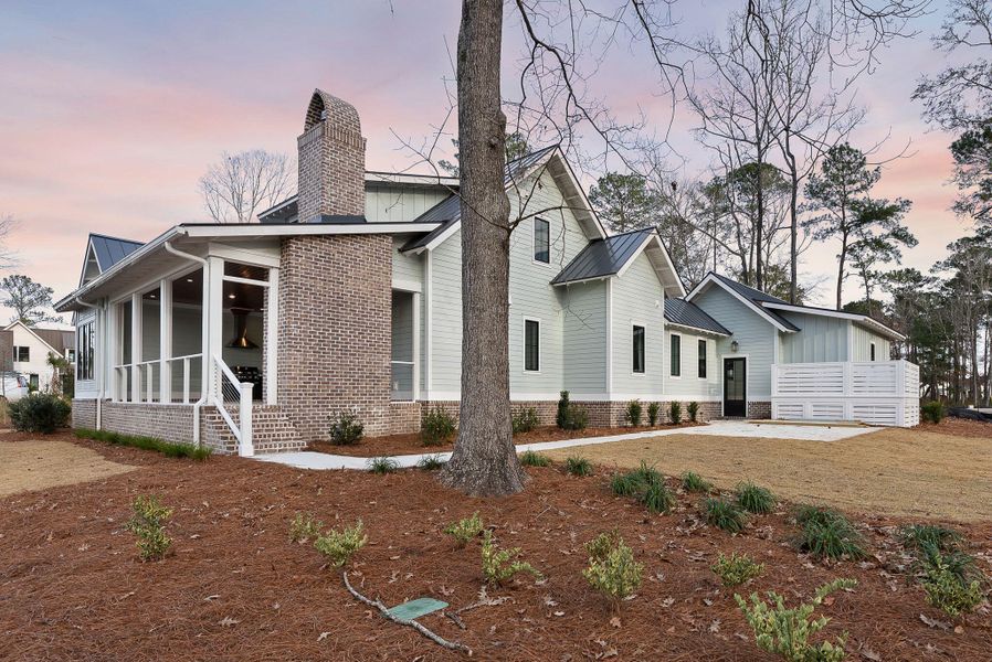 Exterior details and patio area of a home in , Ravenel (Image 36).