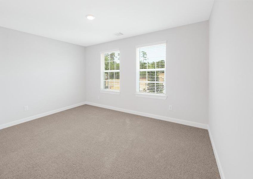 Secondary bedroom with carpet