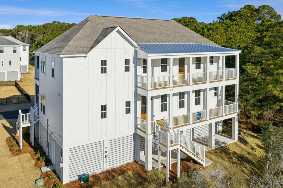 Exterior details and patio area of a home in Overlook at Copahee Sound, Awendaw (Image 38).