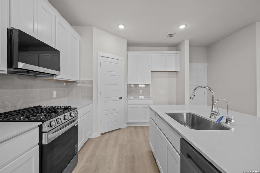 Furnished interior view inside a new home in Senna, Leon Valley (Image 8).