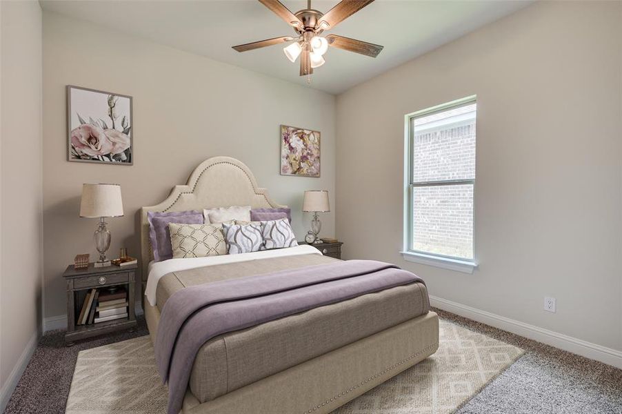 Virtually staged for illustrative purposes only. Carpeted bedroom with ceiling fan