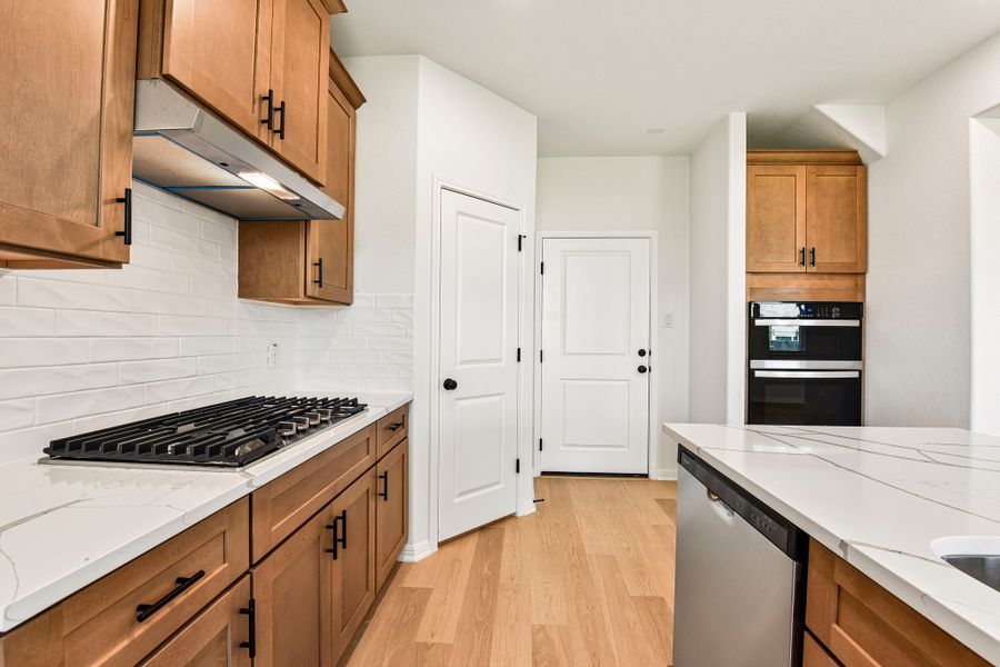 Furnished interior view inside a new home in Crosswinds, Kyle (Image 5).