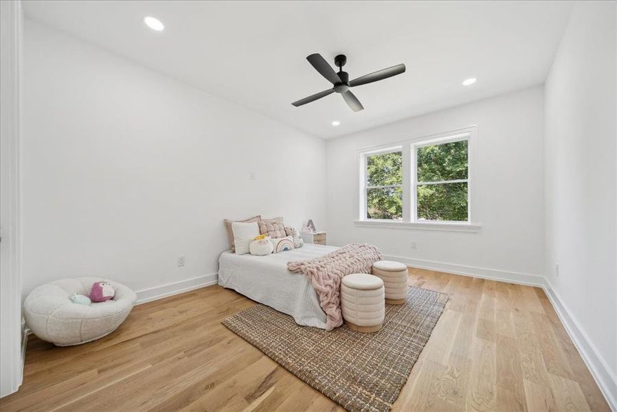 Bedroom featuring light hardwood flooring and ceiling fan