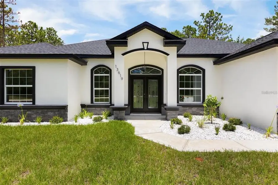 Front exterior of a new home in , Dunnellon, FL, highlighting curb appeal (Image 2).