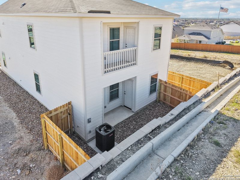 Exterior details and patio area of a home in Magnolia Village North, San Antonio (Image 24).