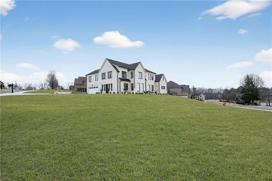Front exterior of a new home in , Hoschton, GA, highlighting curb appeal (Image 27).