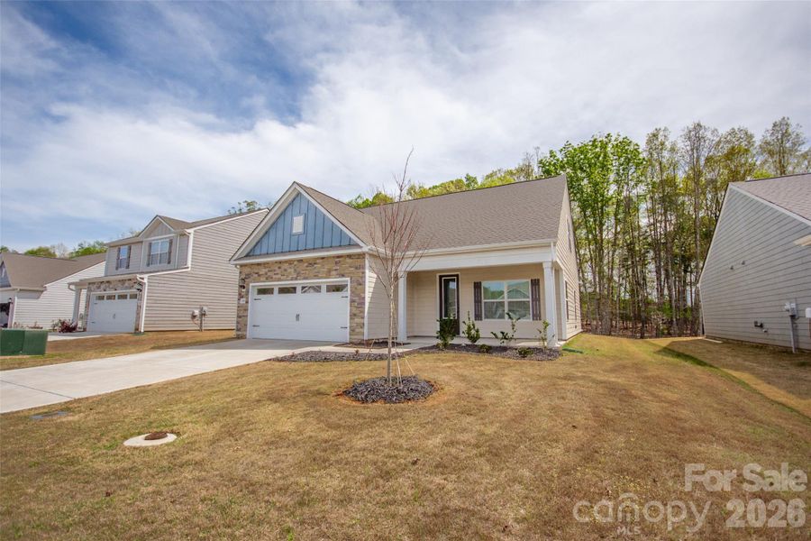 Front exterior of a new home in Colonial Crossing, Troutman, NC, highlighting curb appeal (Image 19).