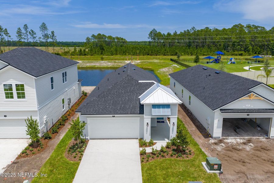 Front exterior of a new home in Beacon Lake, St. Augustine, FL, highlighting curb appeal (Image 33).
