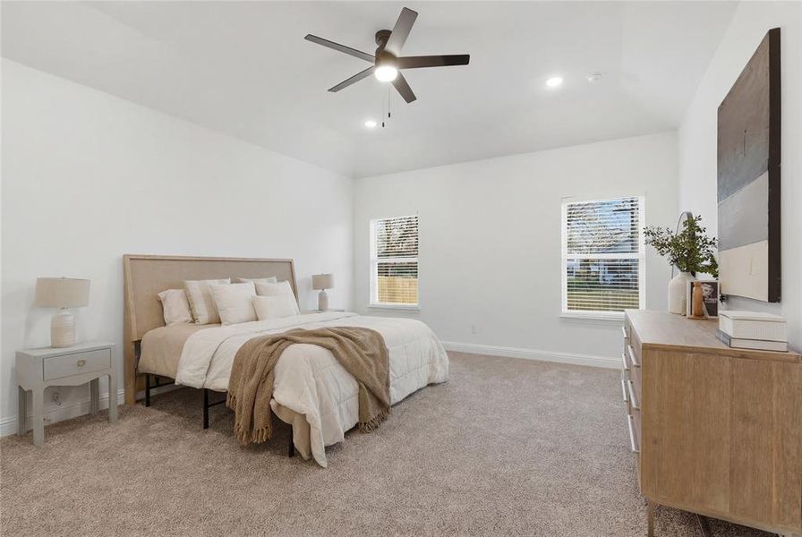 Bedroom featuring light carpet, a ceiling fan, vaulted ceiling, and recessed lighting