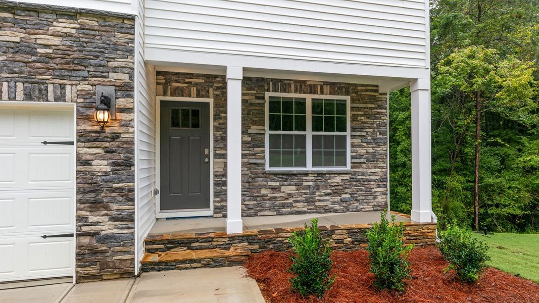 Exterior details and patio area of a home in Ridgewood Farms, Winterville (Image 3).