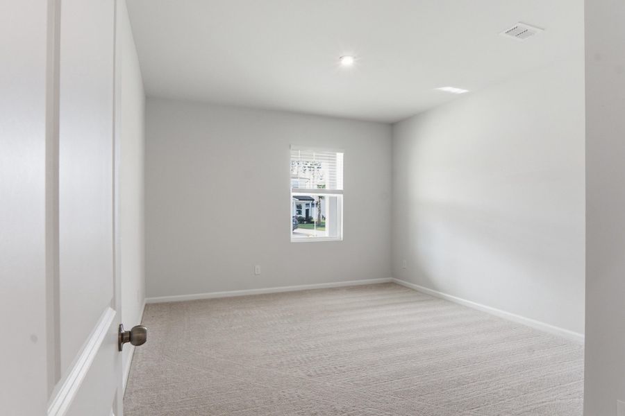 Spacious, unfurnished interior of a new home in Sanctuary Cove at Cane Bay, Summerville (Image 46).