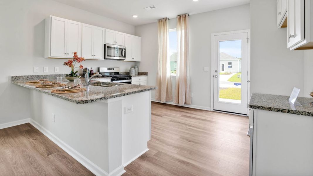 Representative furnished interior of a home built from the LEWIS by D.R. Horton in The Cottages at Blake Farm, Wilmington (Image 20).