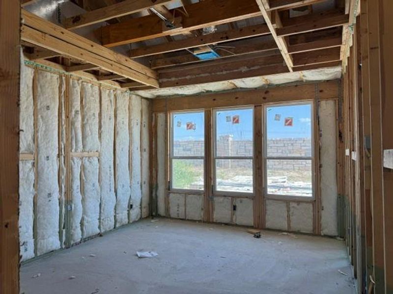 Witness the early stages of construction, revealing the structural framework and insulation within this future living space.