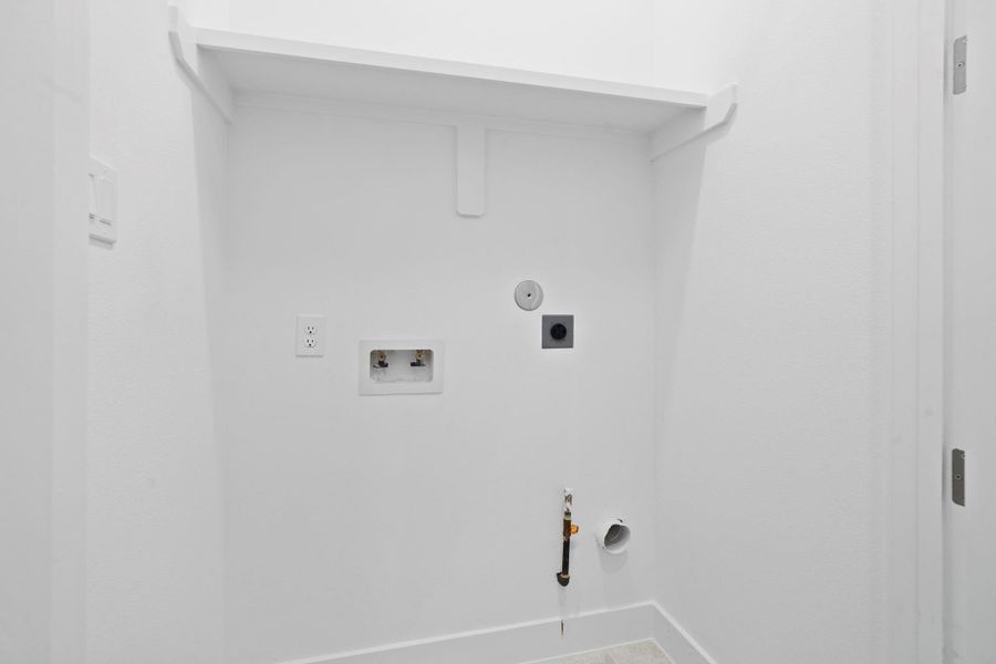 A versatile utility room ready for a washer and dryer