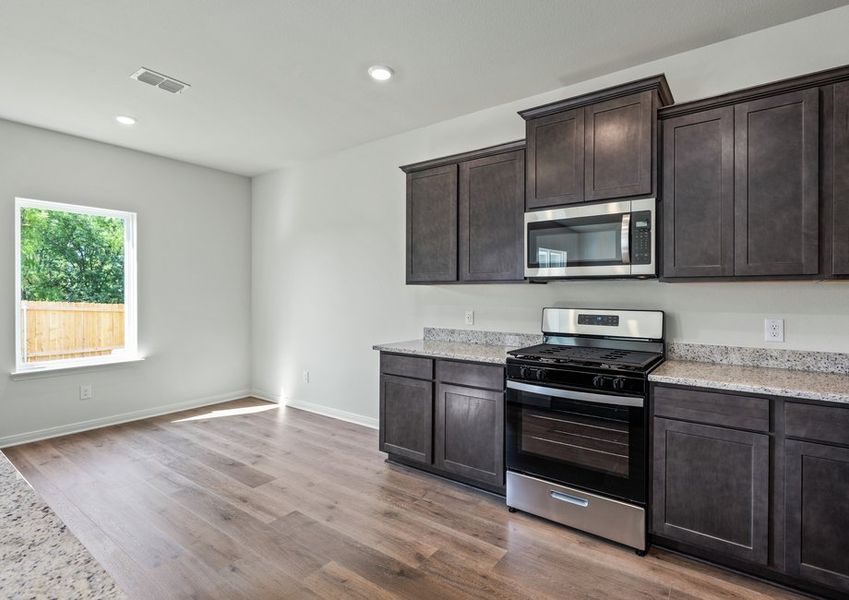 The dining room sits adjacent to the kitchen. The dining room sits adjacent to the kitchen.