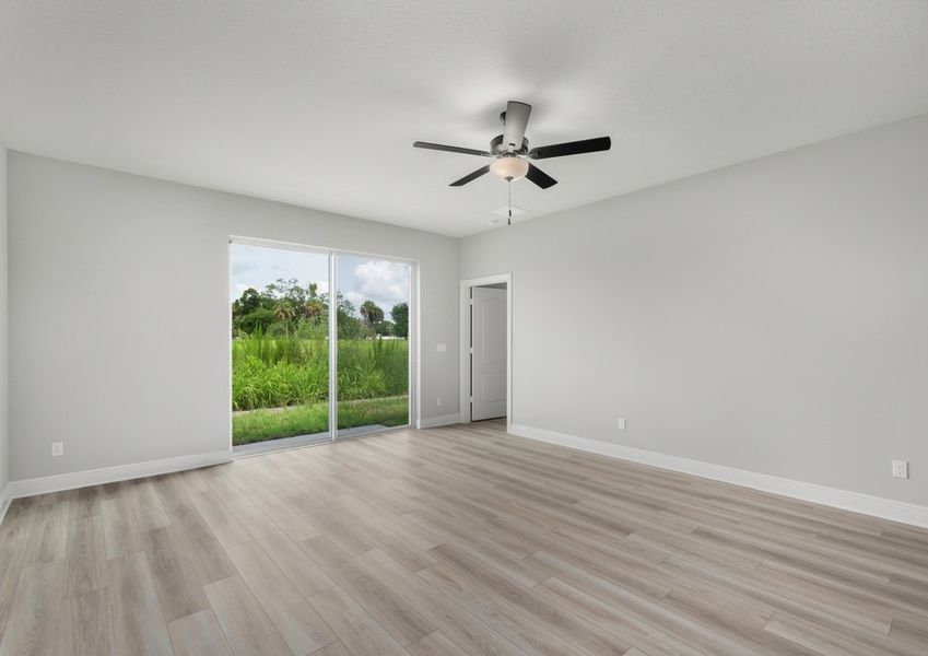 Family room with a sliding galls door that leads to the backyard Family room with a sliding galls door that leads to the backyard