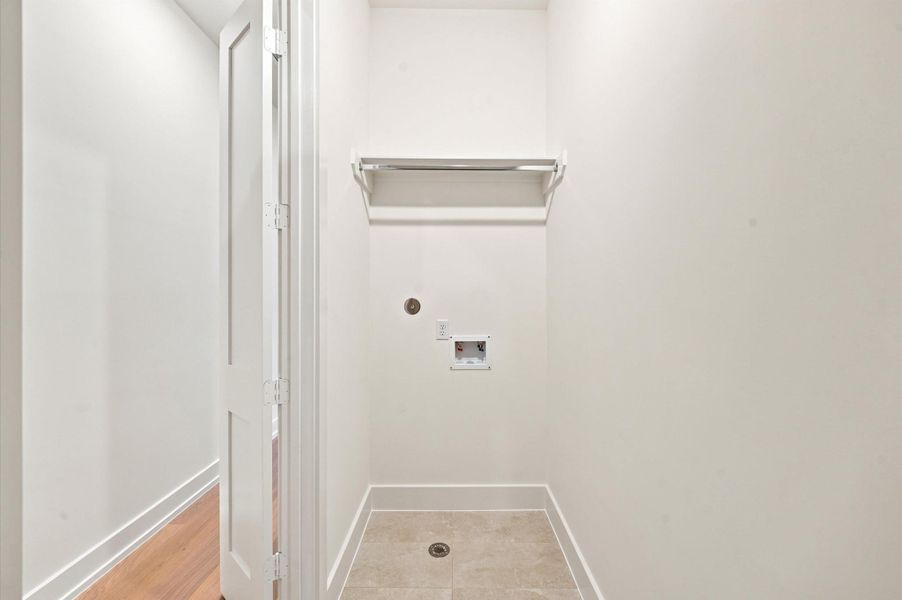 Laundry room conveniently located on second floor.