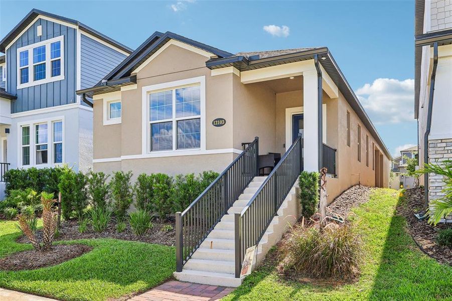 Front exterior of a new home in , Winter Garden, FL, highlighting curb appeal (Image 23). Front exterior of a new home in , Winter Garden, FL, highlighting curb appeal (Image 23).