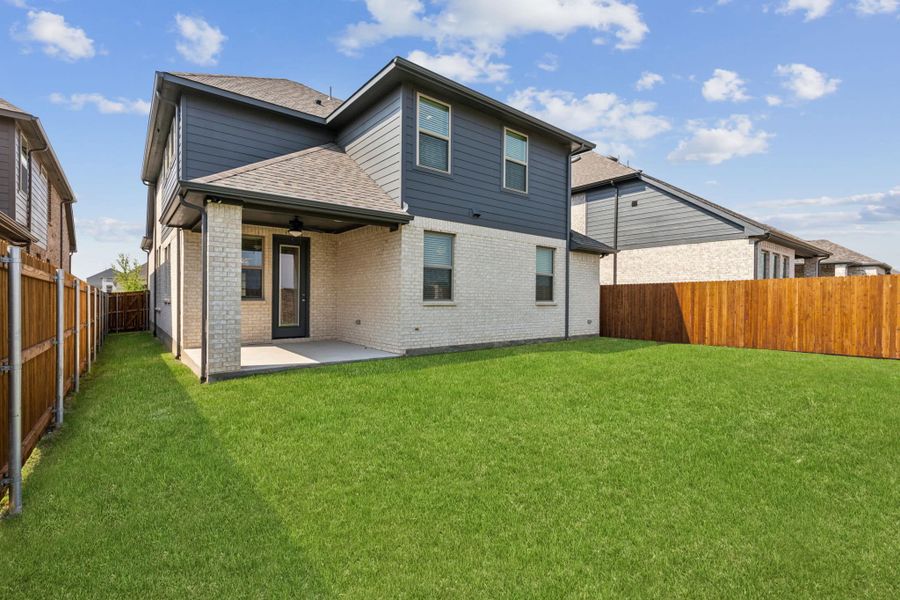 Representative exterior photo of a completed home built from the Boston by Chesmar Homes in Avondale, Fate, TX (Image 2).