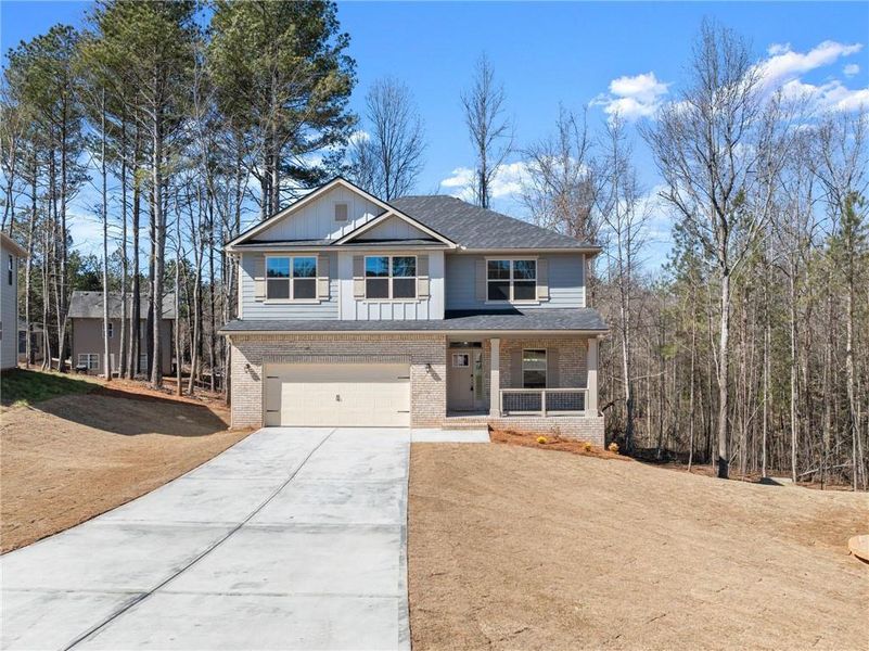 Front exterior of a new home in Magnolia Villas, Cornelia, GA, highlighting curb appeal (Image 23).