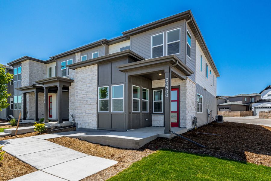 Front exterior of a new home in Painted Prairie, Aurora, CO, highlighting curb appeal (Image 24). Front exterior of a new home in Painted Prairie, Aurora, CO, highlighting curb appeal (Image 24).