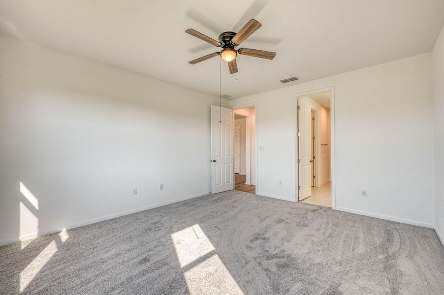 Soft carpeting underfoot defines this comfortable room with clean lines.