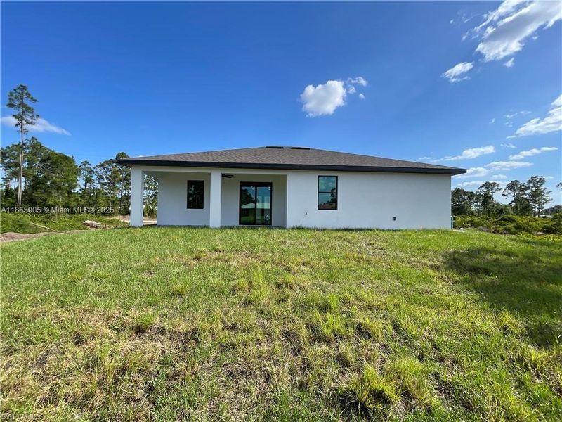 Exterior details and patio area of a home in , Lehigh Acres (Image 4).