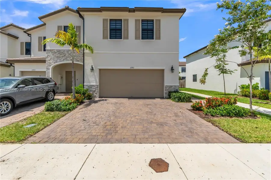 Front exterior of a new home in , Miami, FL, highlighting curb appeal (Image 21).