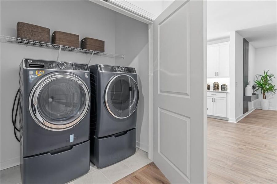 Laundry Area*Images from the model home. Not subject unit*