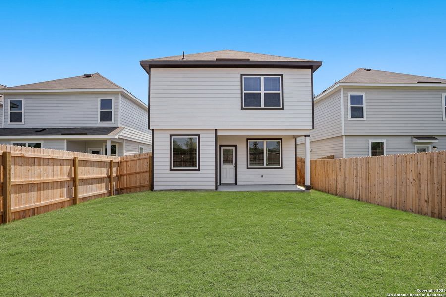Front exterior of a new home in Melissa Ranch, San Antonio, TX, highlighting curb appeal (Image 1).