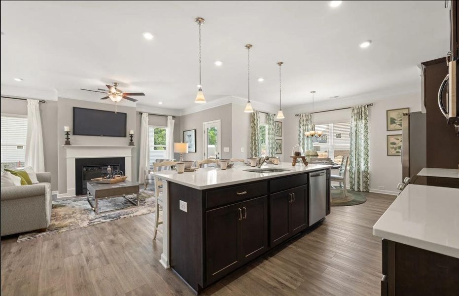 The Brambling- Kitchen into Family Room. Home under construction. Sample photo used for illustrative purposes only, elevation, upgrades, selection, brick, siding and colors will vary. The Brambling- Kitchen into Family Room. Home under construction. Sample photo used for illustrative purposes only, elevation, upgrades, selection, brick, siding and colors will vary.