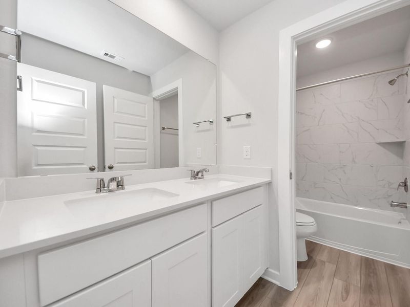 Furnished interior view inside a new home in Windmill Estates, Magnolia (Image 25).