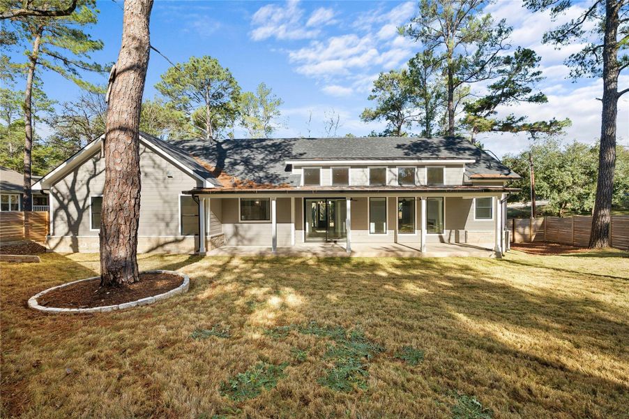 Back of house featuring a patio area and a yard
