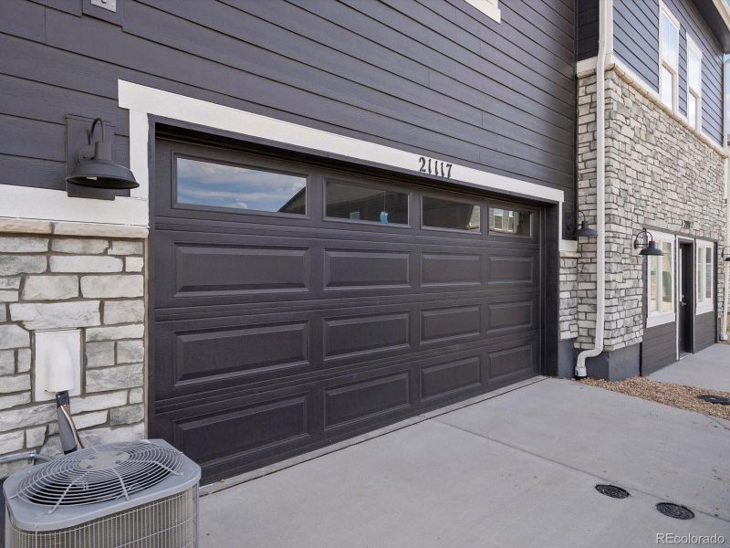 Front exterior of a new home in Skyview at High Point, Aurora, CO, highlighting curb appeal (Image 1).