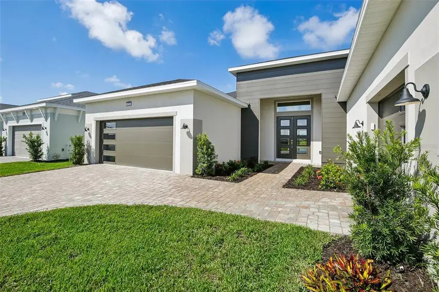 Exterior details and patio area of a home in Biscayne Landing at Seaire, Parrish (Image 2). Exterior details and patio area of a home in Biscayne Landing at Seaire, Parrish (Image 2).