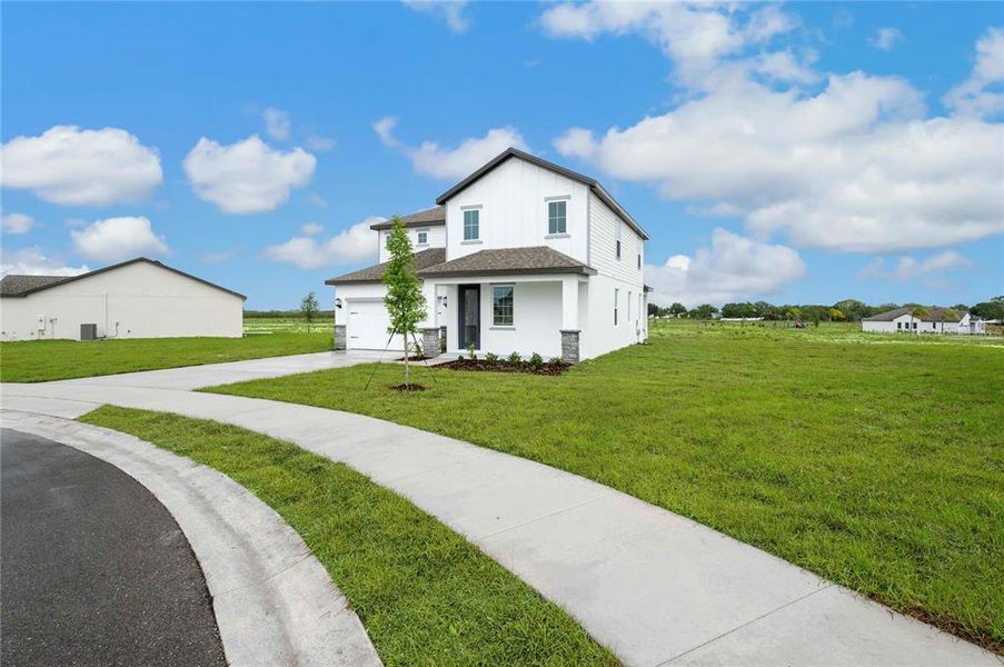 Front exterior of a new home in Citrus Place, Babson Park, FL, highlighting curb appeal (Image 19).